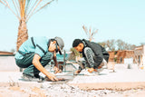 Two men repairing a skatepark for the concrete jungle foundation
