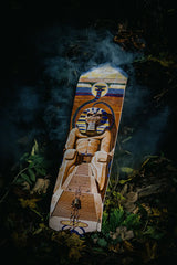 The Powerslave skate deck by Iron Maiden in a spooky, foggy forest scenery at night.