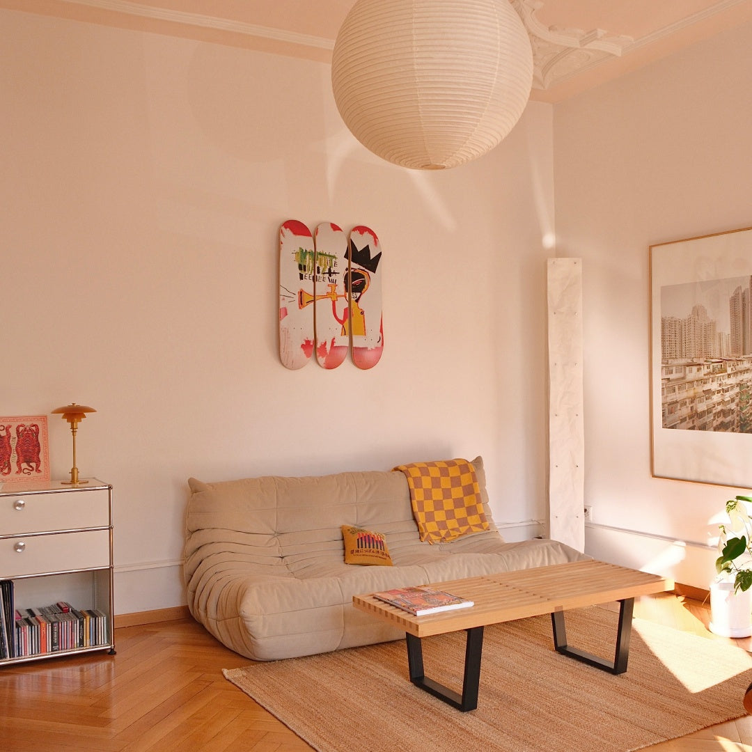 Jean-Michel Basquiat "Trumpet" skateboard wall art by THE SKATEROOM in a japandi interior apartment