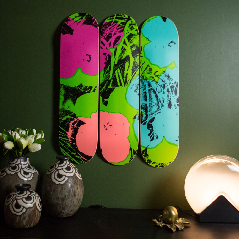Andy warhol skateboard wall art the flower series green and pink by THE SKATEROOM in an apartment