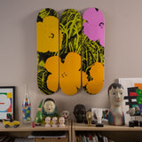 Andy warhol the flower series lime orange by THE SKATEROOM on the wall of an apartment
