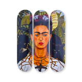 Frida Kahlo's 'Self-Portrait with Thorn Necklace and Hummingbird' reimagined on a triptych skateboard deck by THE SKATEROOM. Featuring Kahlo’s piercing gaze, a black cat, monkey, and lush botanical background, this edition captures her iconic symbolism and deep emotional expression.