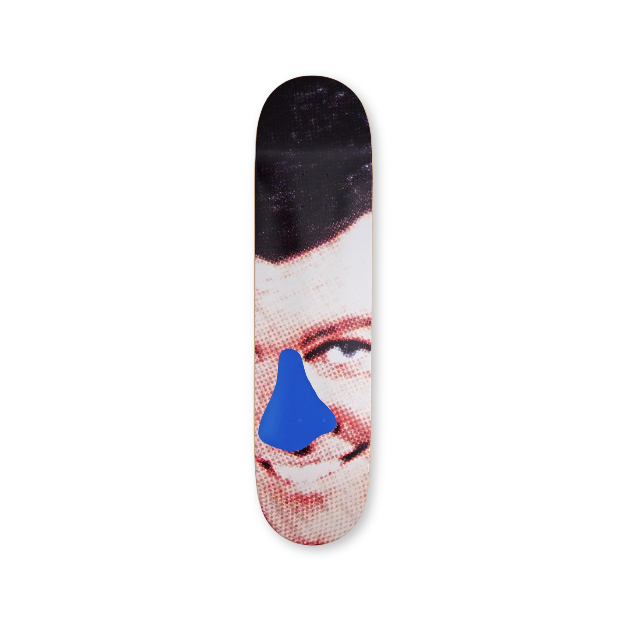 Close-up of a smiling face with a blue shape over the nose on a John Baldessari skateboard deck, produced by THE SKATEROOM.
