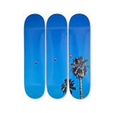 Baldessari triptych skateboard decks showing red balls in blue sky with palm trees, from THE SKATEROOM collection.