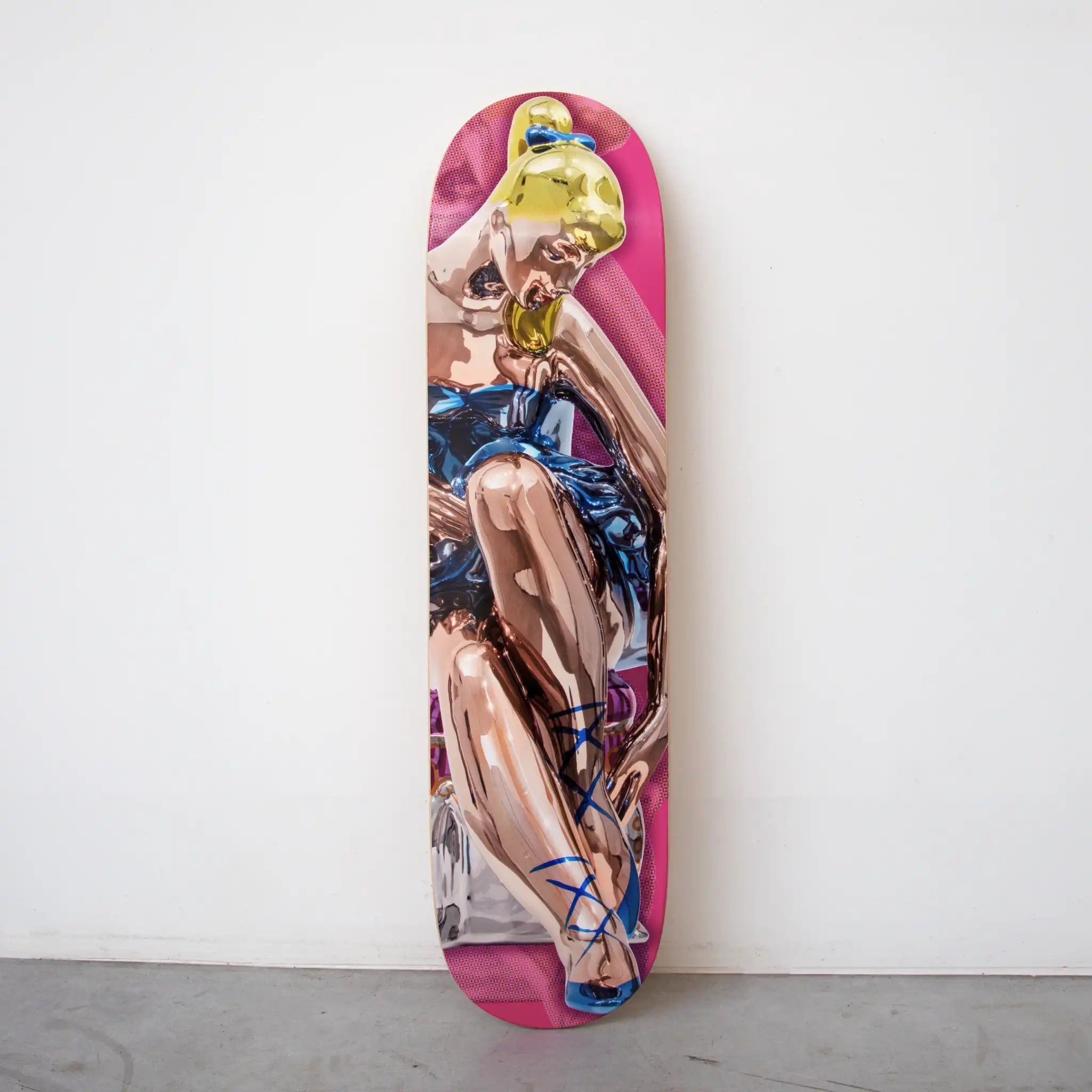Jeff Koons Seated Ballerina Skateboard photographed against concrete wall. Part of the 2025 limited edition by THE SKATEROOM.