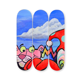 VEXX ‘The Life of the Party’ Original Triptych #1 featuring hand-painted skate decks with a surreal scene of the Pink Panther, clouds, and a red polka-dot hat on a blue sky background.