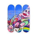VEXX ‘The Life of the Party’ Original Triptych #3 featuring hand-painted skate decks with a vibrant composition of surreal rabbit-like faces, rainbow arcs, and expressive eyes beneath a blue sky with plane trails.