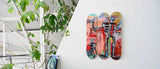 Basquiat skateboard print showcased on an elegant wall, blending counter culture, modern art, and interior design