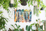 artist jules de balincort limited edition art skateboards hanging on wall surrounded by plants