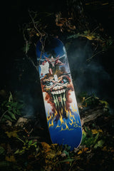 The Evil That Men Do skate deck by Iron Maiden in a spooky, foggy forest scenery.
