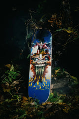 The Evil That Men Do skate deck by Iron Maiden in a forest at night.
