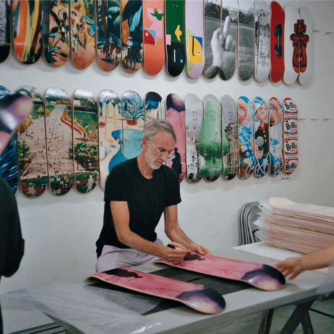 Artist Jules de Balincourt signing his Looking for an Enlightened Cowboy THE SKATEROOM skate art edition