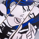 Drowning Girl skate decks by Roy Lichtenstein and THE SKATEROOM lying on a concrete floor