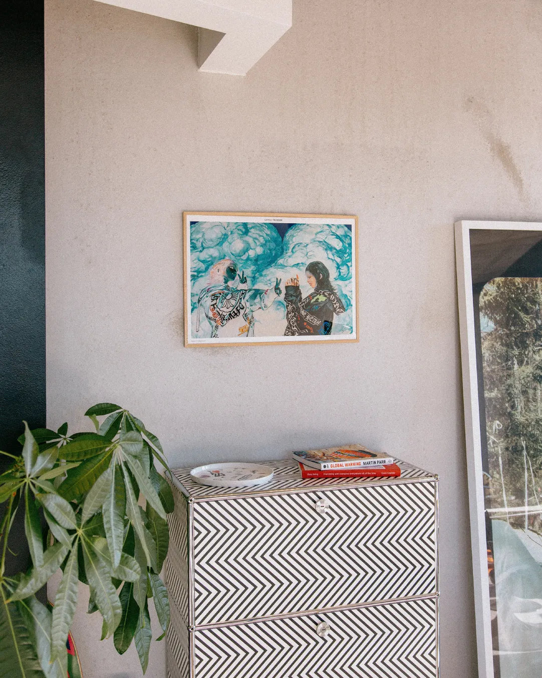 Framed Reality Dropout art print by Little Thunder on a wall above a patterned dresser