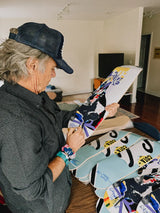 Artist David Carson hand signing collectible limited edition skate deck.