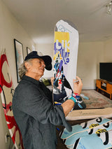 Artist and graphic designer David Carson checking out his limited edition skate deck.