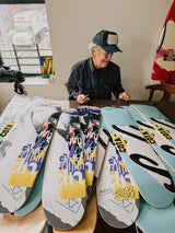 Artist and graphic designer David Carson hand signing limited edition skate decks.