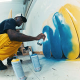 Artist Slawn spray painting skate decks original artworks