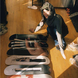artist john yuyi with her skate art collection
