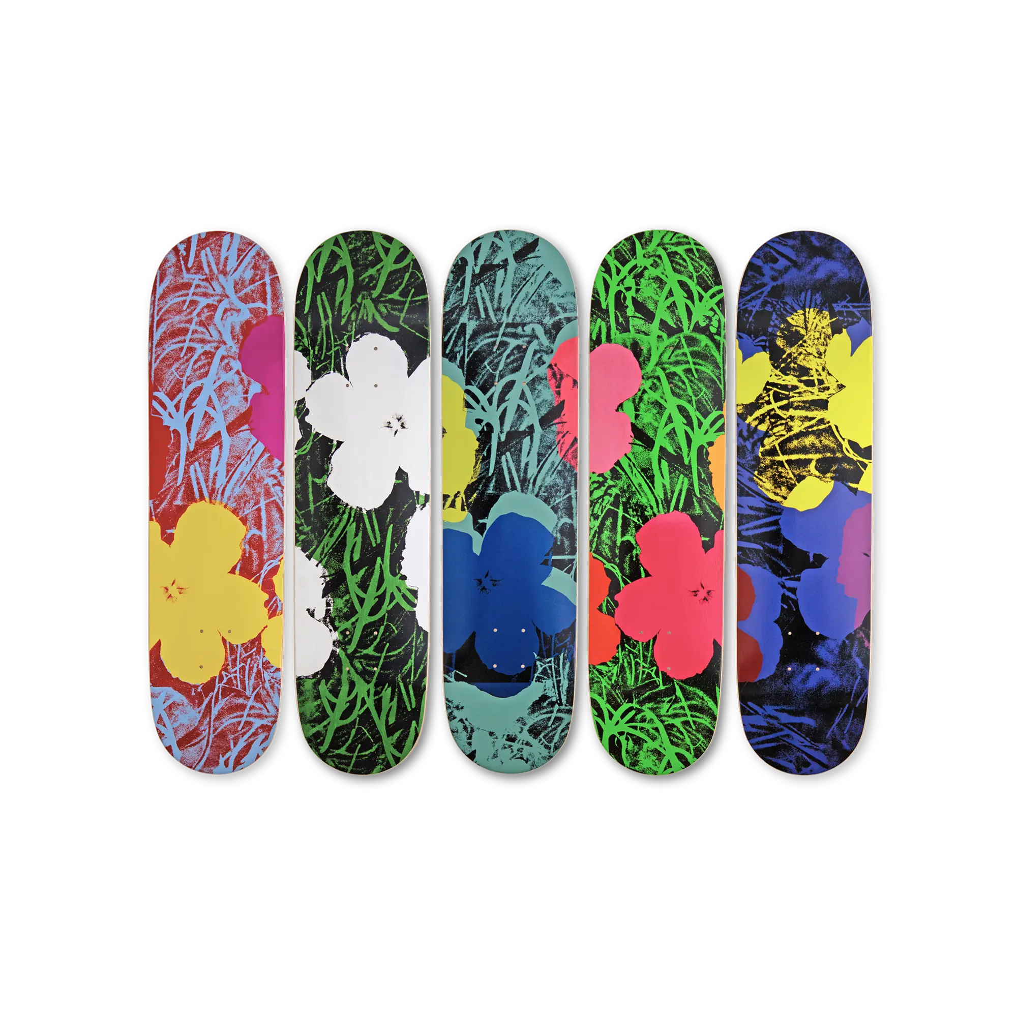 Five colorful skateboard decks with floral and abstract designs by Andy Warhol and THE SKATEROOM.