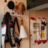 Jean-Michel Basquiat "Trumpet" skateboard wall art by THE SKATEROOM in a modern design apartment