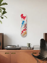 Beni Bischof What The Fuck art skateboard by The Skateroom displayed on a wall in a contemporary interior