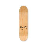 Wooden skateboard deck with 'Monet' signature.