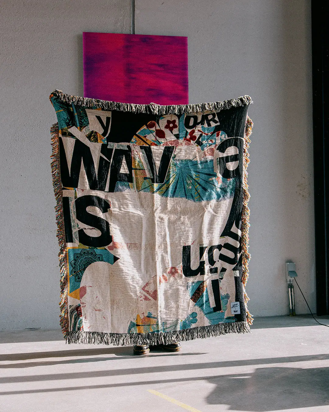 Colorful woven blanket by David Carson, perfect gift for art and design lovers.