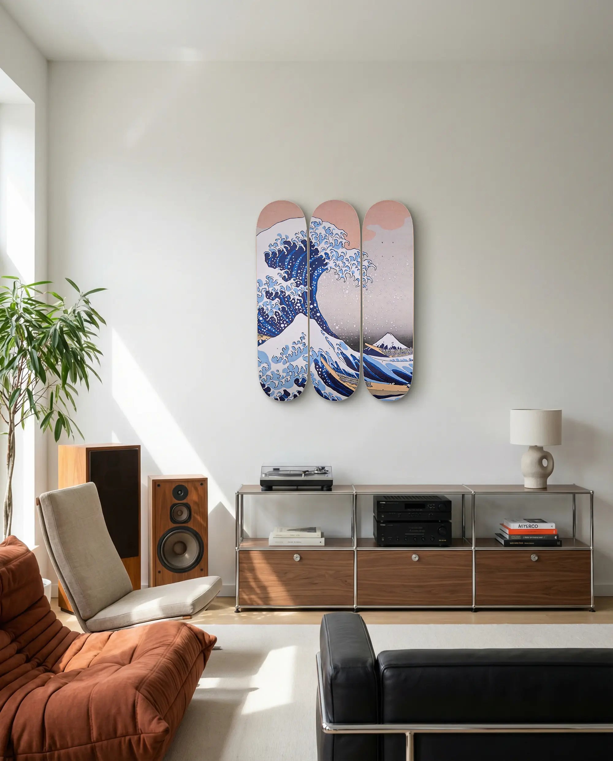Living room with a modern interior design featuring a skateboard triptych wall art piece by Hokusai.