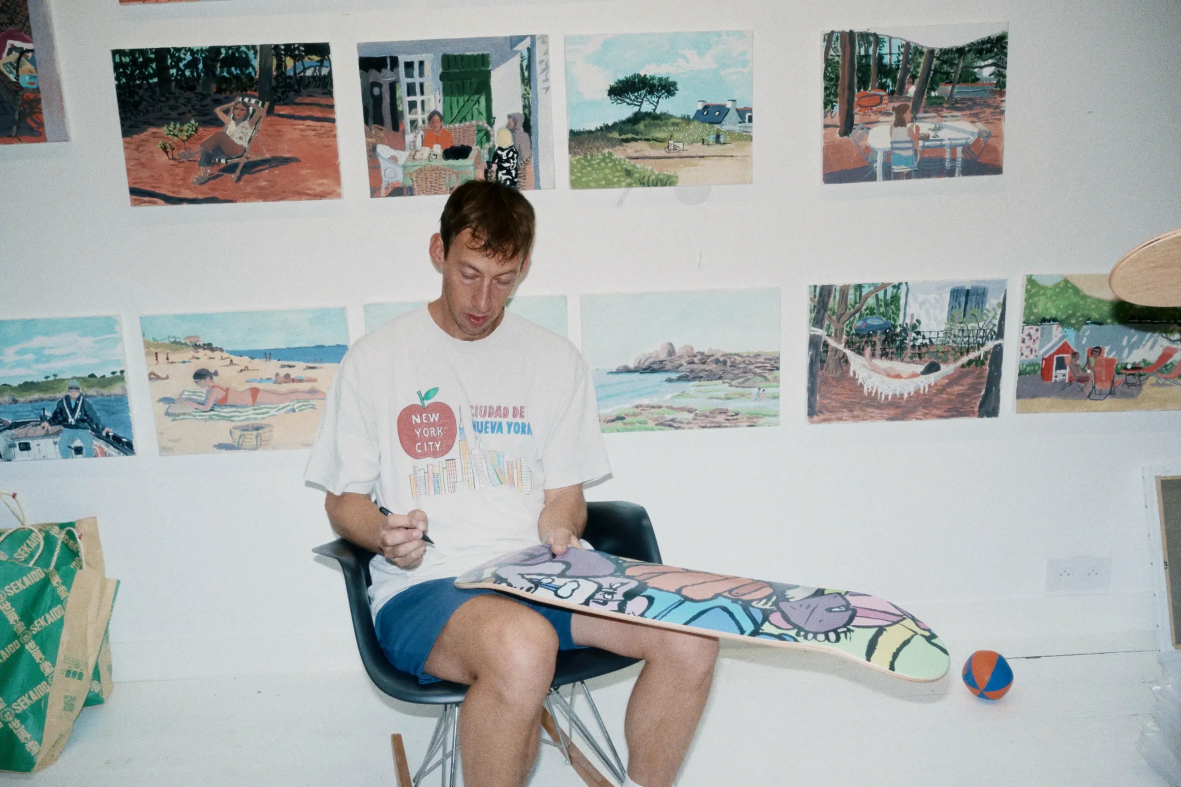 Jean Jullien hand-signing The Republic art skateboard deck for The Skateroom — each edition individually signed by the artist