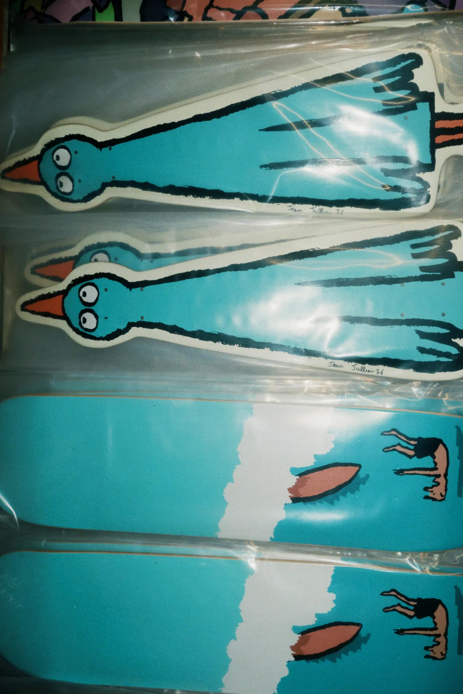 Jean Jullien Cooking art skateboard by The Skateroom, lifestyle photography showing deck in a styled urban setting