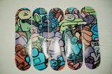 Jean Jullien hand-signing The Republic art skateboard, close-up of artist signature on deck — The Skateroom hand-signed edition
