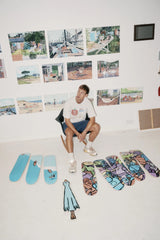Jean Jullien Cooking art skateboards by The Skateroom arranged on the ground, lifestyle overhead shot