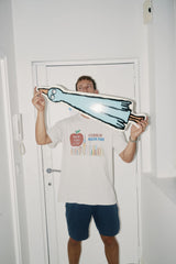 Jean Jullien hand-signing Birdboard art skateboard for The Skateroom — each hand-signed edition individually signed by the artist