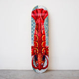 Jeff Koons Lobster Skateboard displayed vertically against a white wall. 2025 limited edition from THE SKATEROOM.