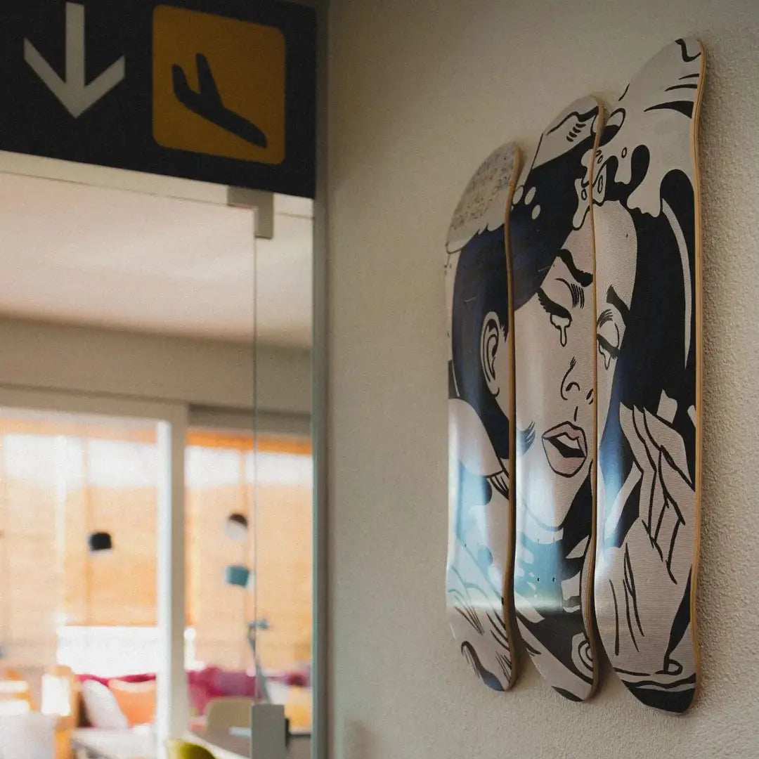 Drowning Girl skate triptych by Roy Lichtenstein hanging on a wall
