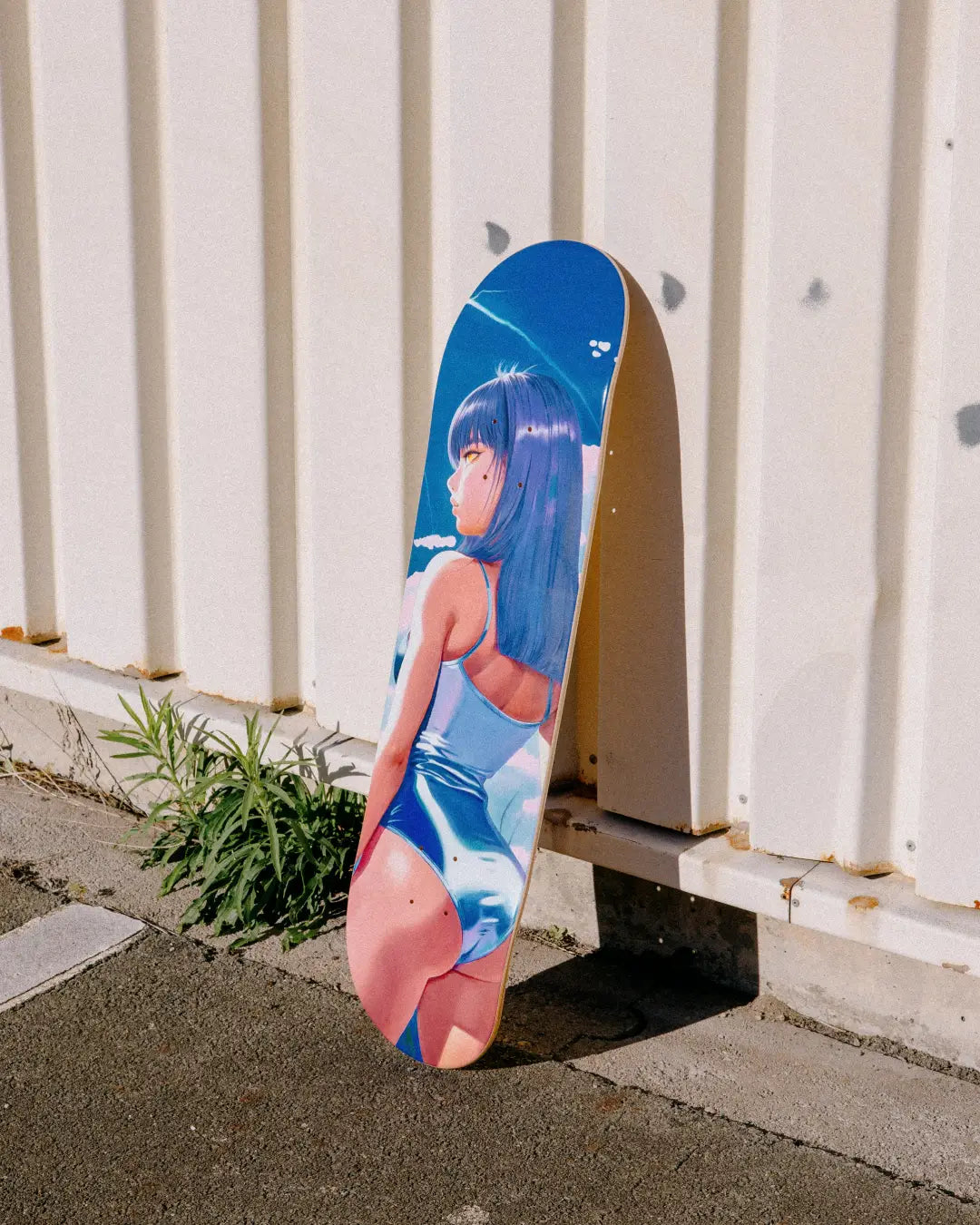 Vitamin Thunder art skateboard by Little Thunder leaning against a white corrugated wall