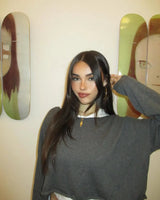 madison beer in front of yoshitomo nara skate decks by the skateroom