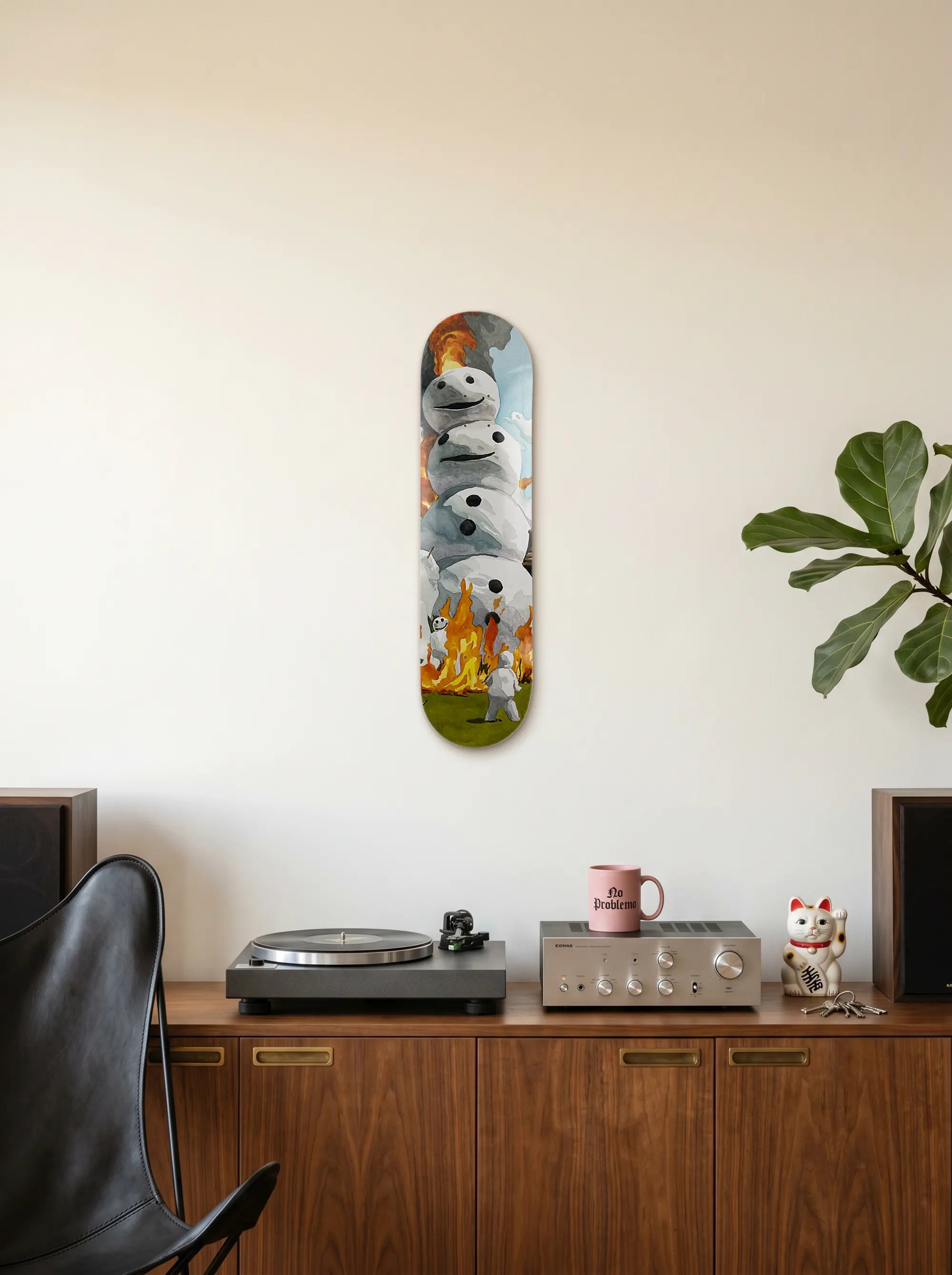 Holy (Burning Snow Man) collectible skate deck by Sangho Noh mounted vertically on a wall in a contemporary living space